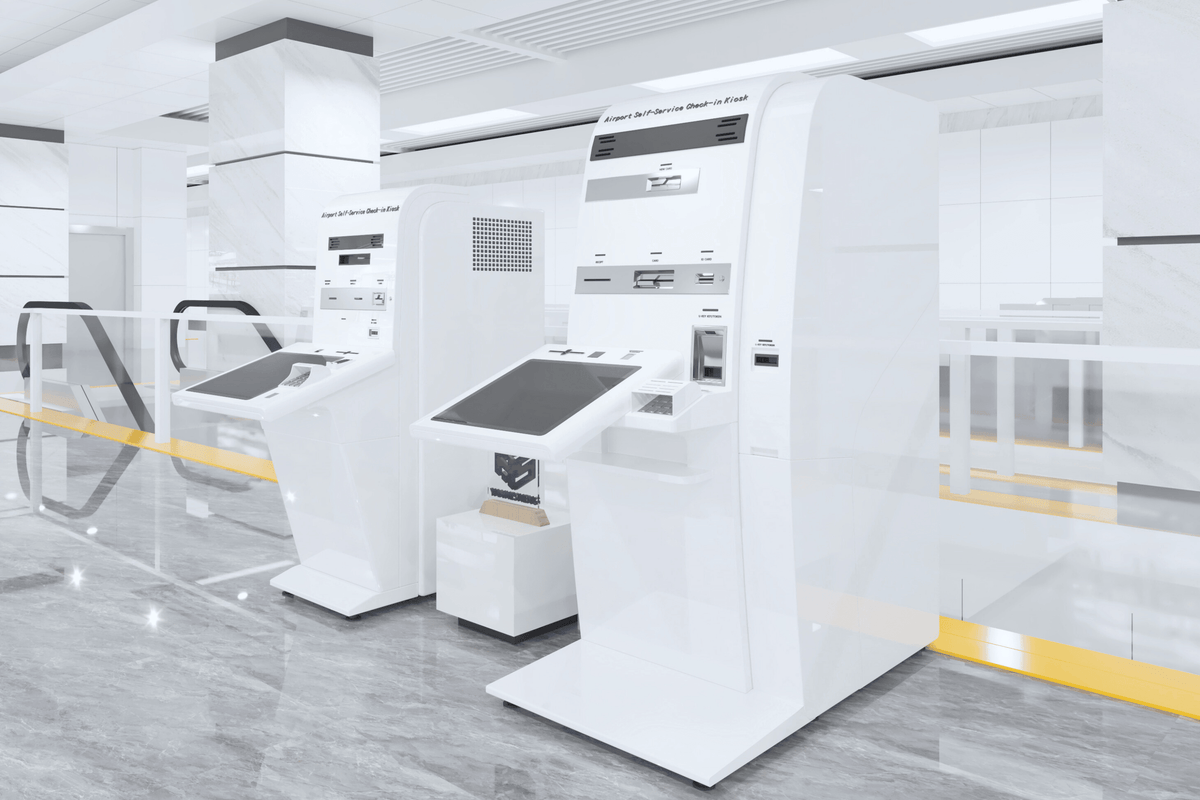 Side view of white self-service airport check-in kiosk housing with seamless acrylic solid surface finish