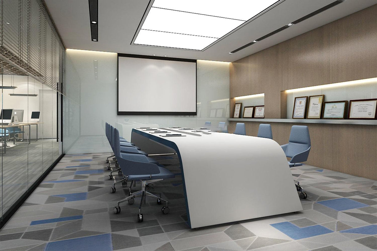 Side view of long solid surface conference table for creative meeting rooms with seamless acrylic solid surface finish