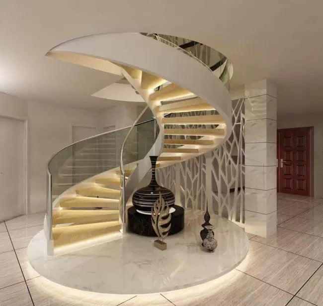 Side view of custom solid surface spiral staircase with glass handrail with seamless acrylic solid surface finish