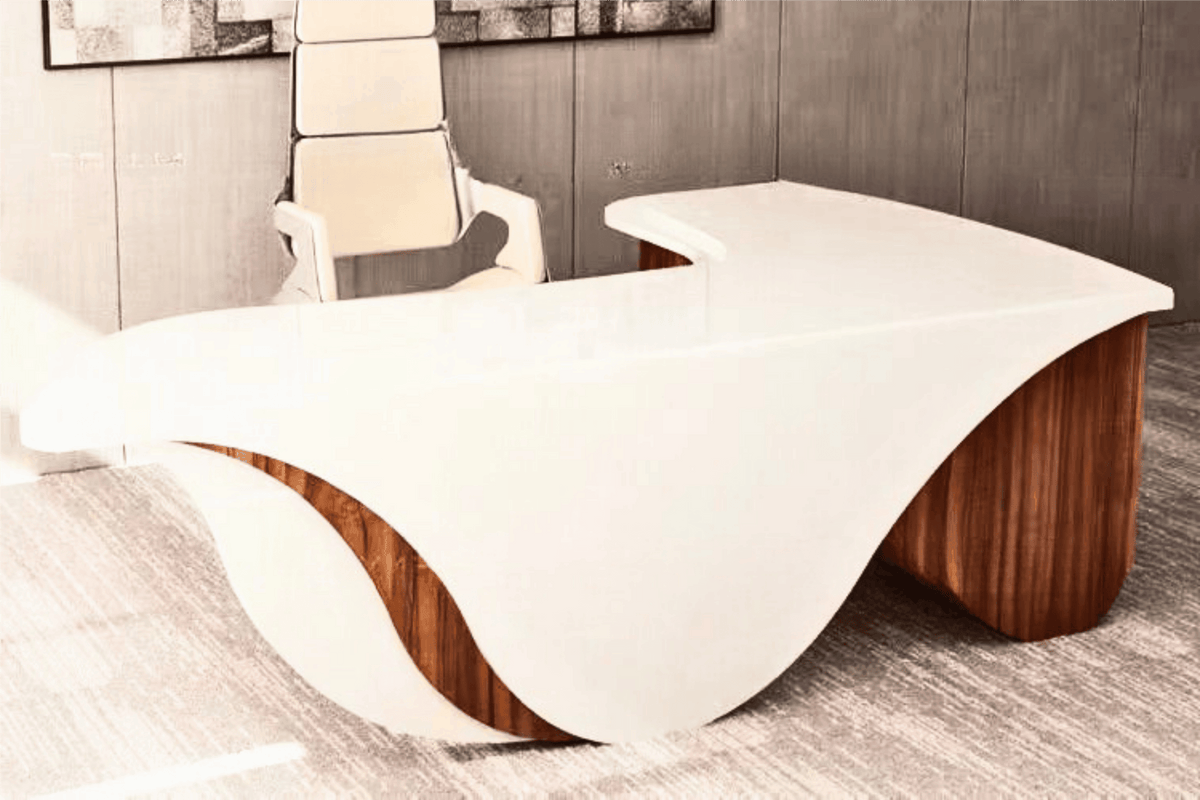 Side view of white l-shaped solid surface manager desk for executive offices with seamless acrylic solid surface finish