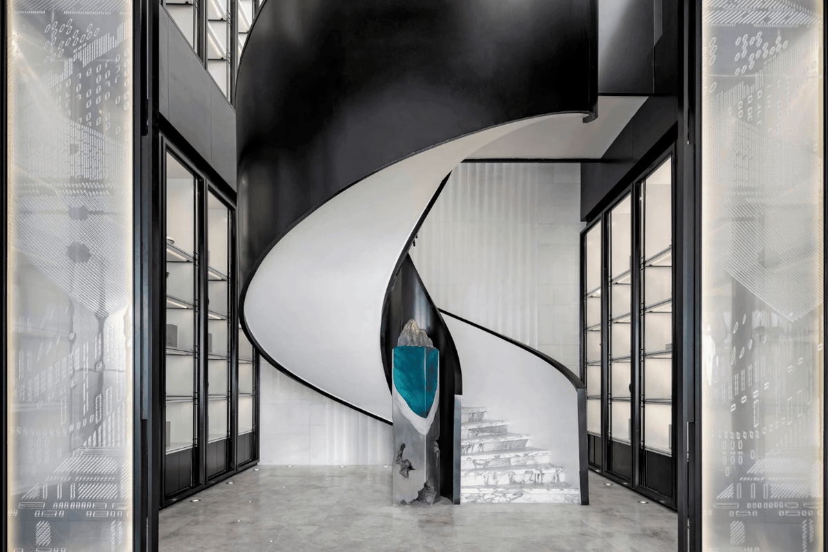 Side view of black and white solid surface spiral staircase for villa interiors with seamless acrylic solid surface finish