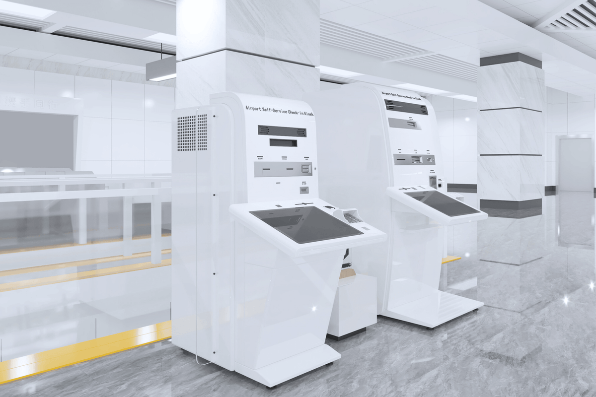 Side view of white self-service airport check-in kiosk housing with seamless acrylic solid surface finish