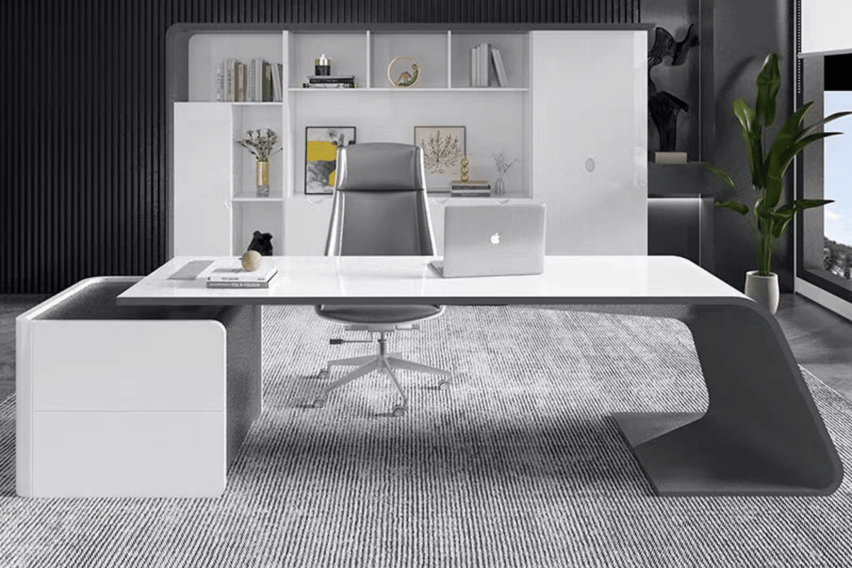 Side view of white minimalist solid surface boss desk for creative offices with seamless acrylic solid surface finish