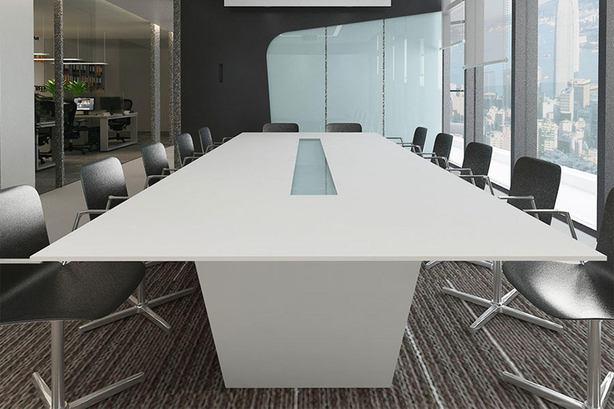 Side view of white minimalist solid surface office conference table with seamless acrylic solid surface finish