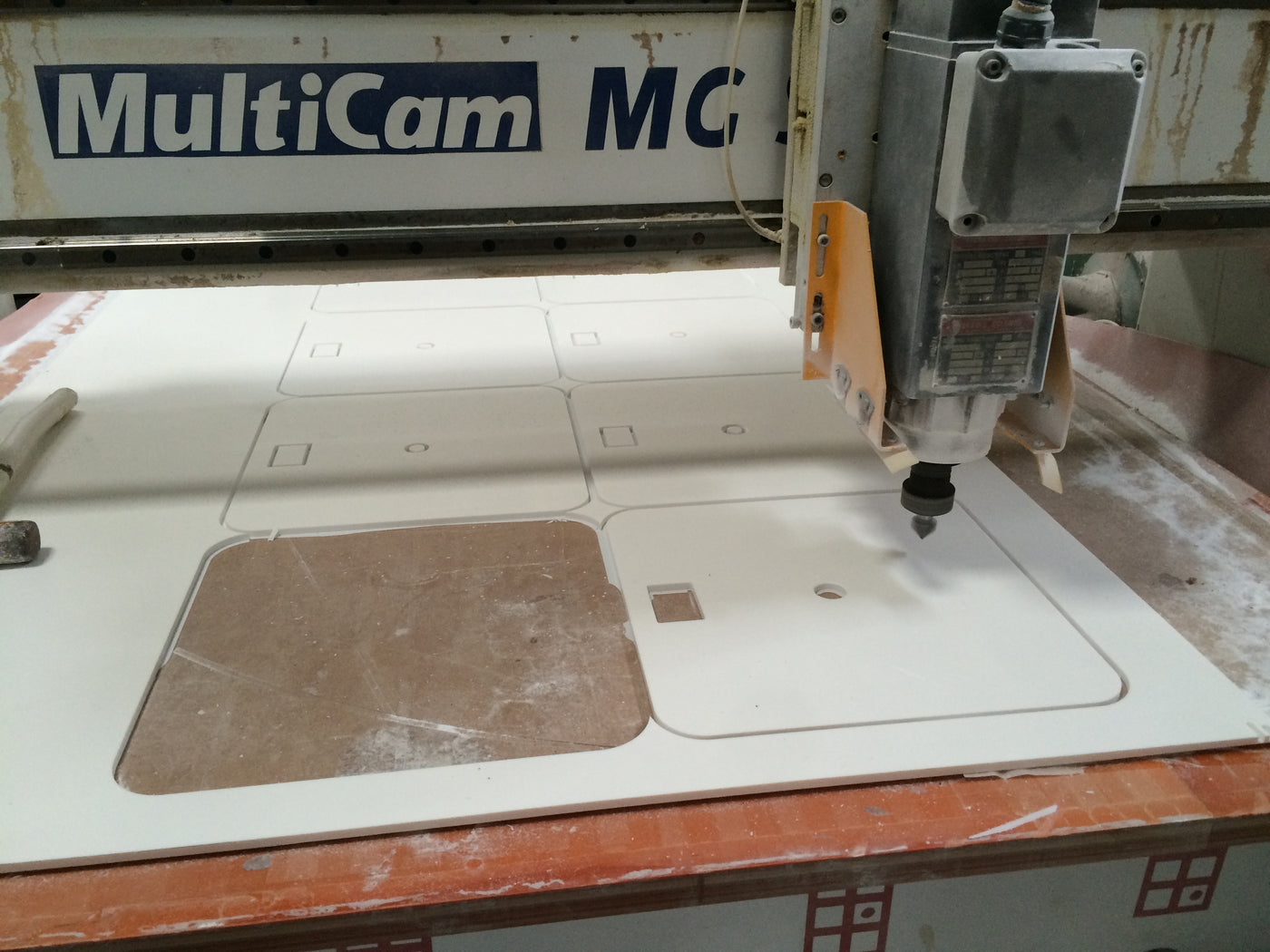 CNC router cutting equipment and interface openings in a solid surface panel