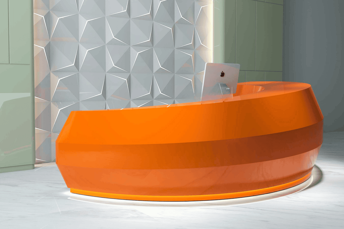 Side view of half-round solid surface hotel reception desk with seamless acrylic solid surface finish