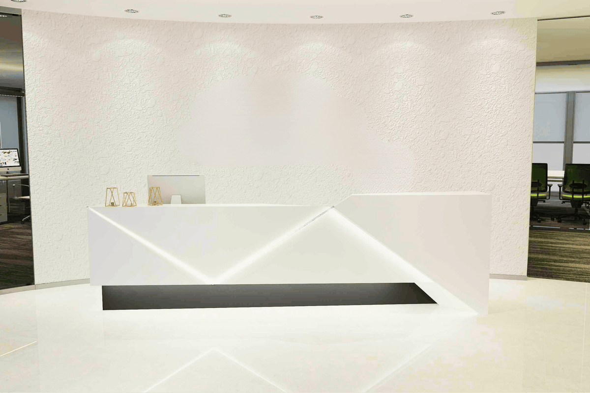 Side view of led solid surface reception desk for premium company lobbies with seamless acrylic solid surface finish