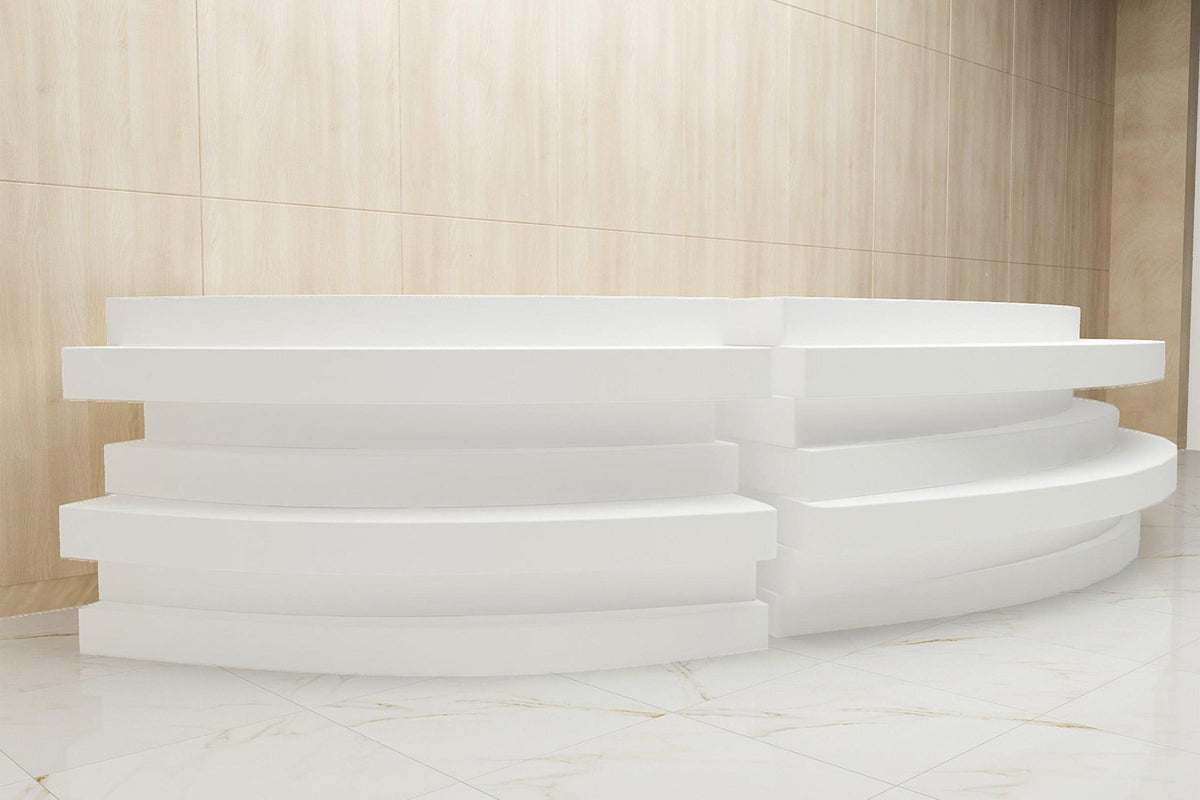 Side view of factory custom half-round solid surface reception counter with seamless acrylic solid surface finish