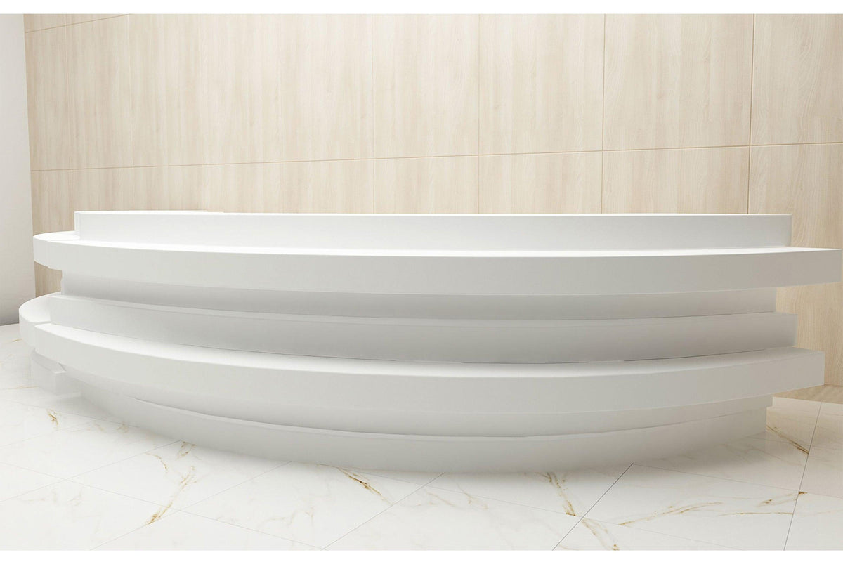 Side view of factory custom half-round solid surface reception counter with seamless acrylic solid surface finish