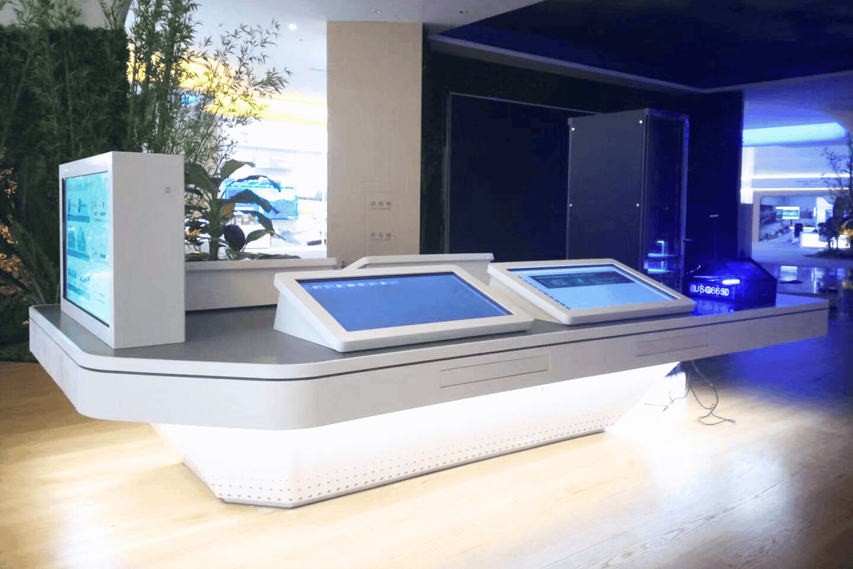 Side view of custom solid surface airport check-in counter with kiosk integration with seamless acrylic solid surface finish