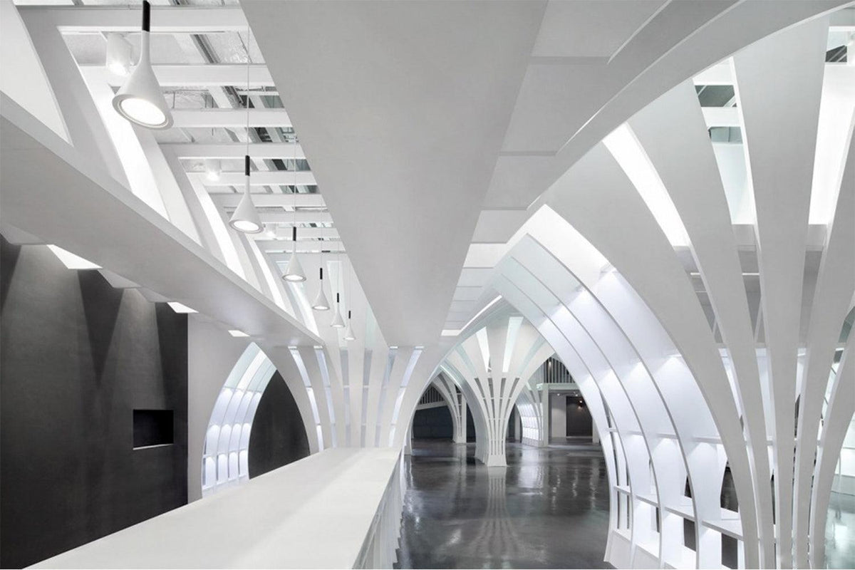 Side view of custom solid surface ceiling panel system for commercial interiors with seamless acrylic solid surface finish