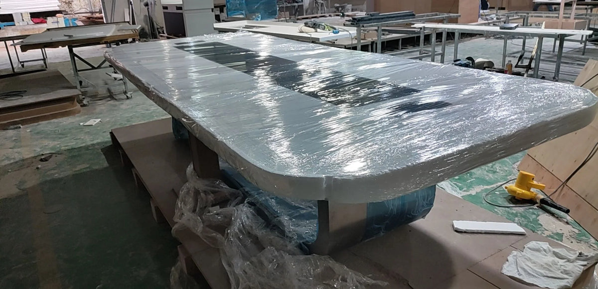 Rounded conference table top and perimeter covered with transparent protective film