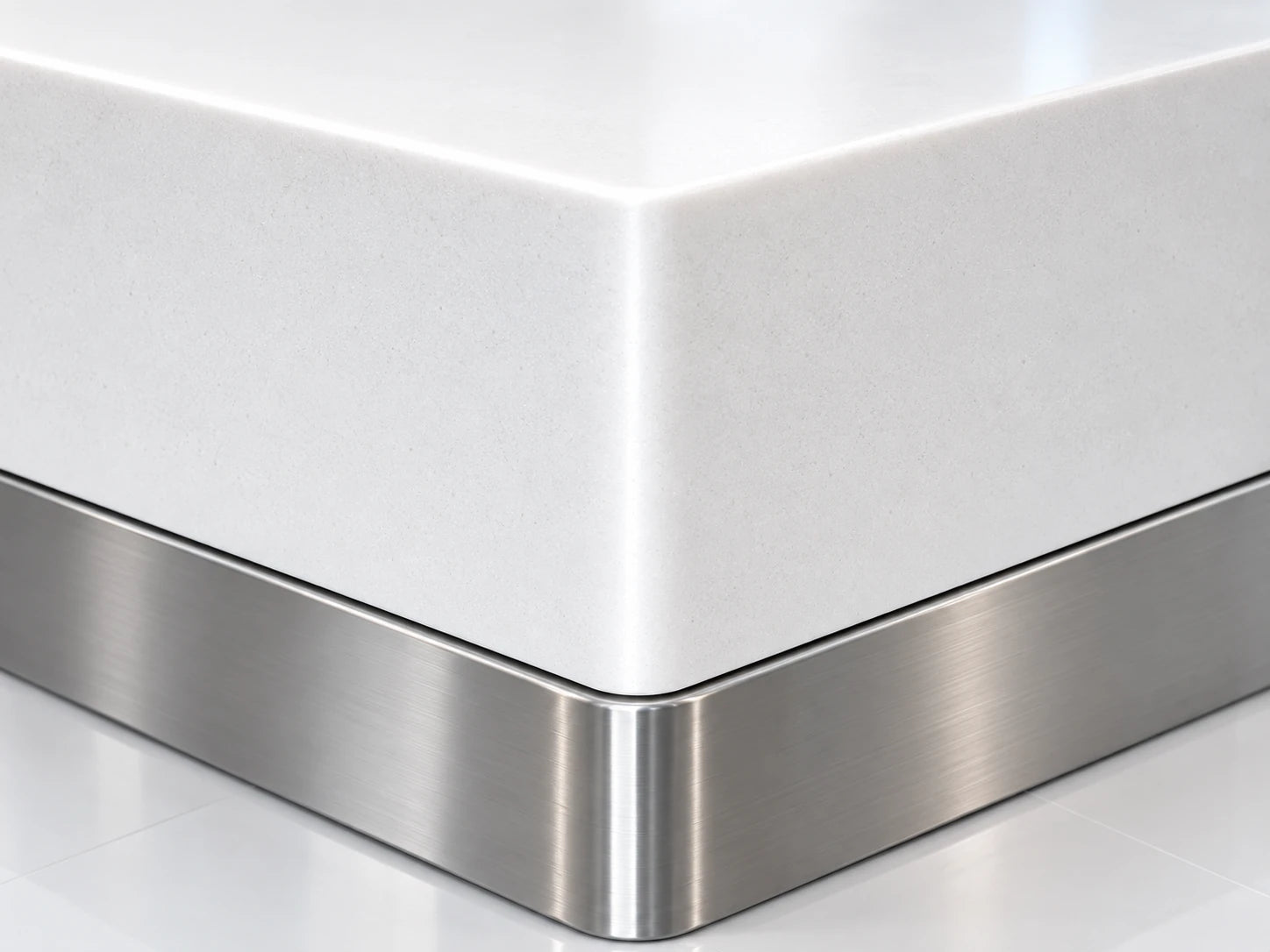 Concept close-up of a white solid-surface counter corner above a metal plinth